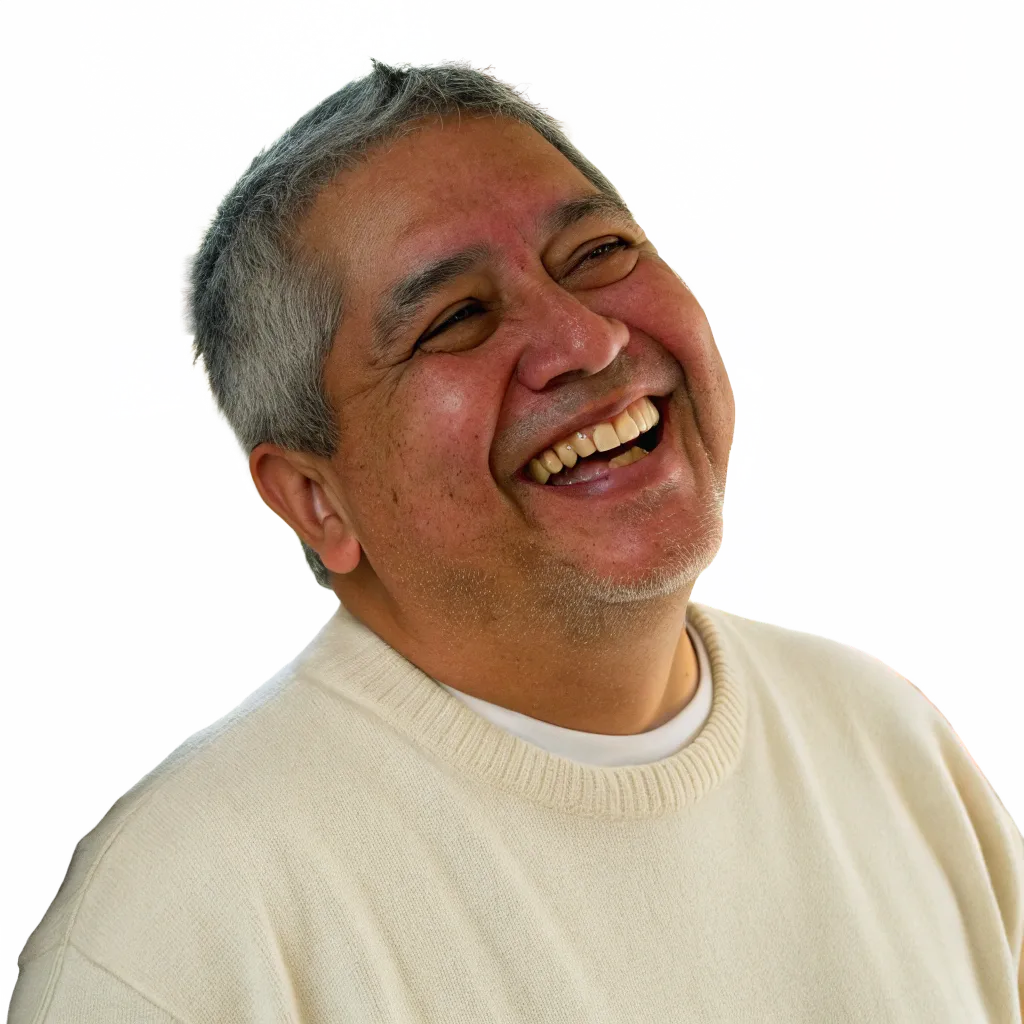 Man laughing warmly wearing a cream sweater